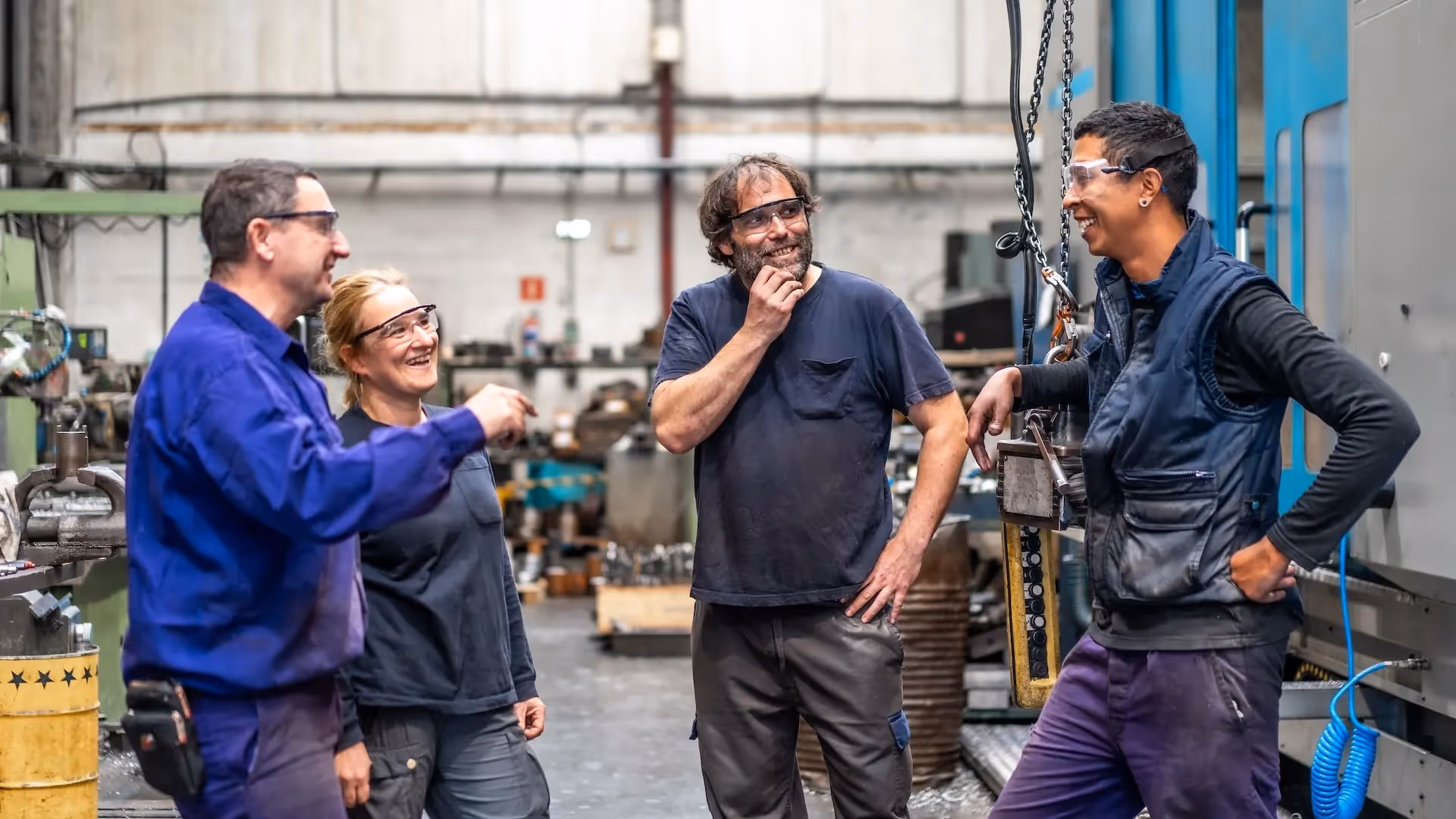 Workers laughing at metal industry job — After the Sale