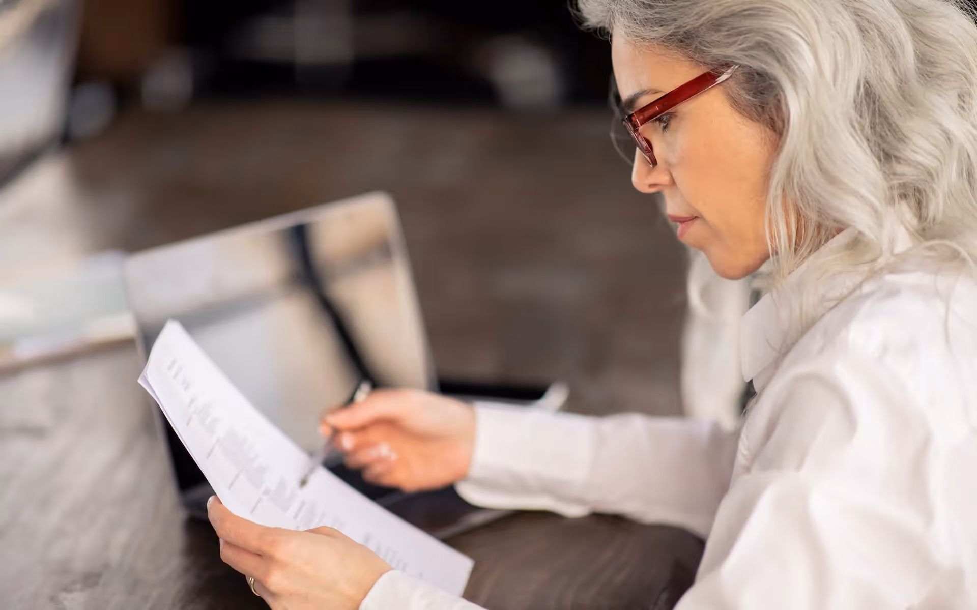 Business owner reading an LOI in office