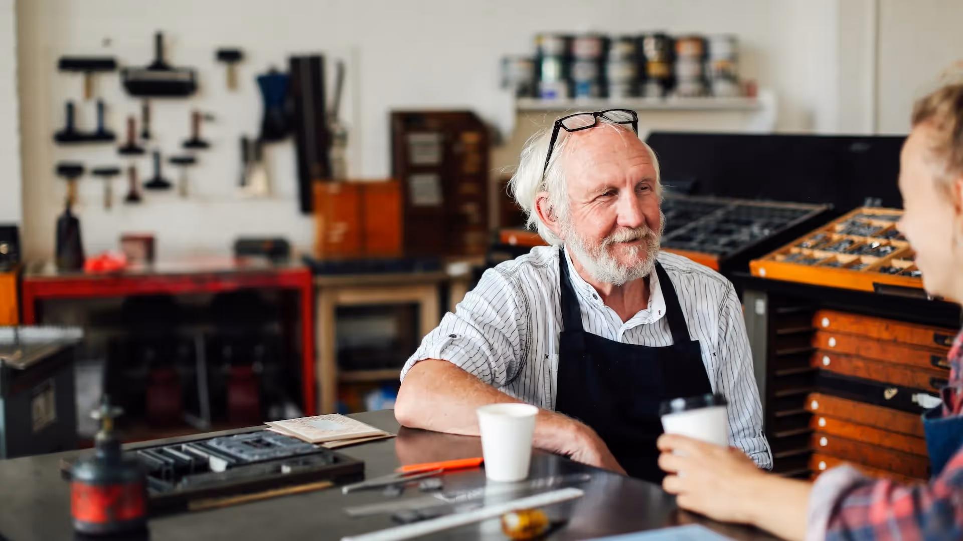 Senior craftsman with young apprentice — Maximizing Value