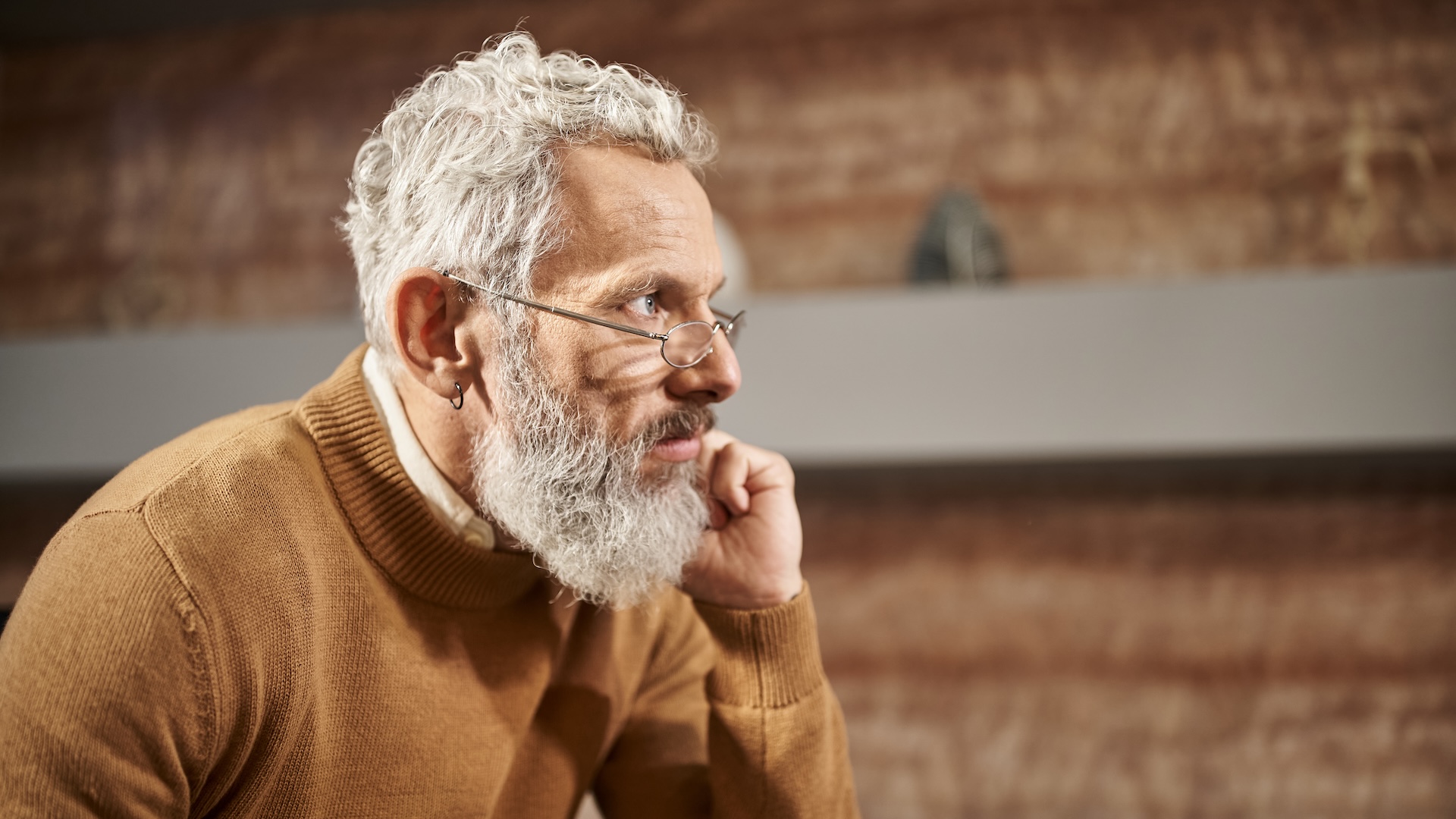 Image of a older business owner deep in thought
