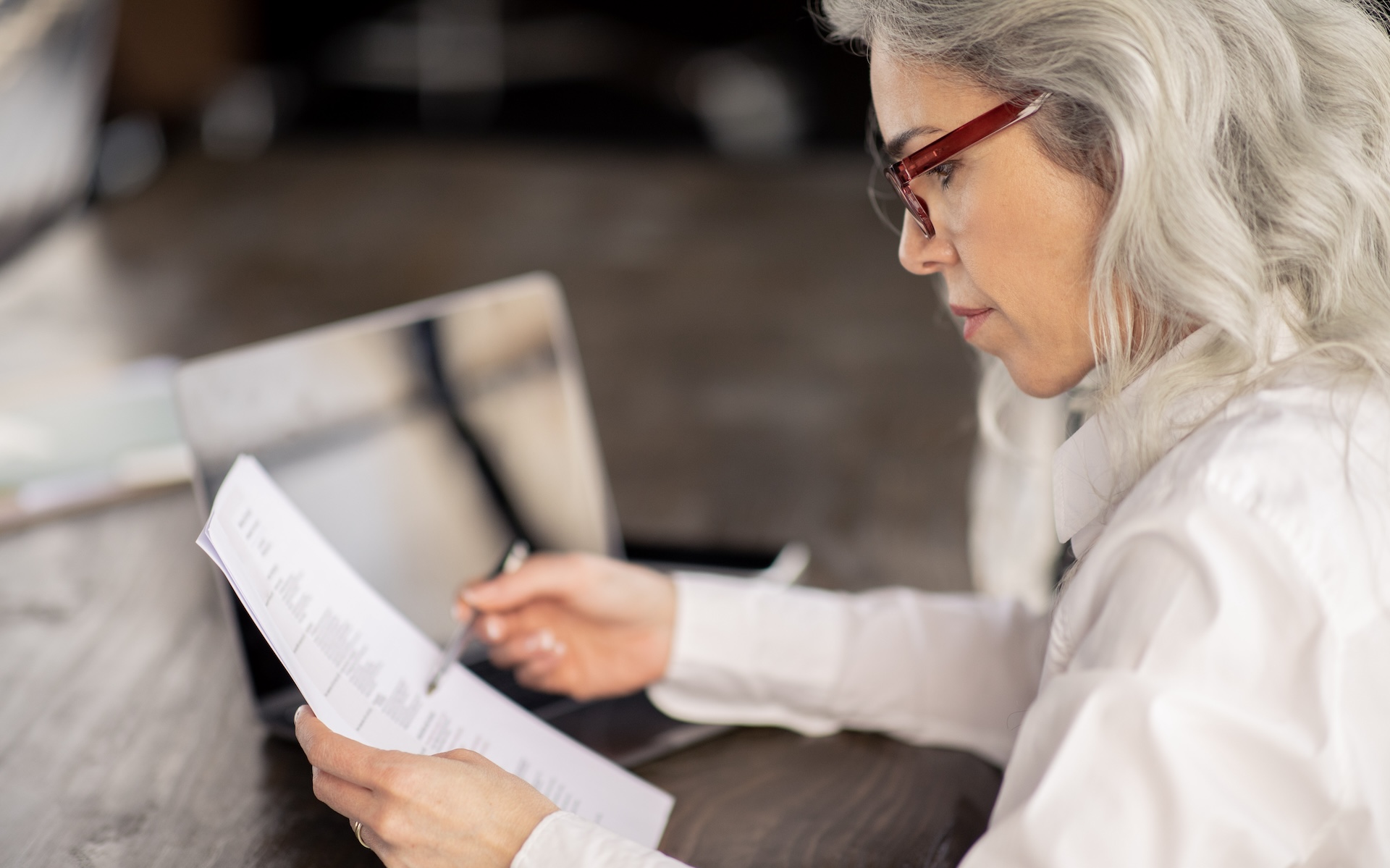 Image of business owner reading LOI in her office