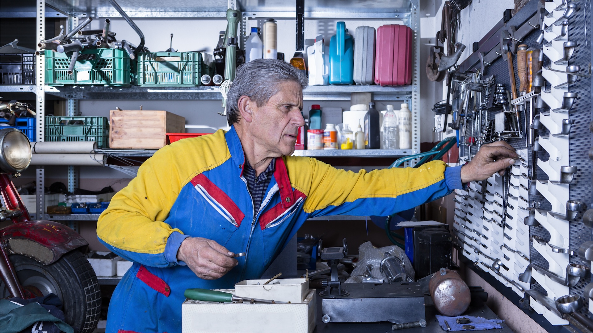 Image of business owner in mechanics shop